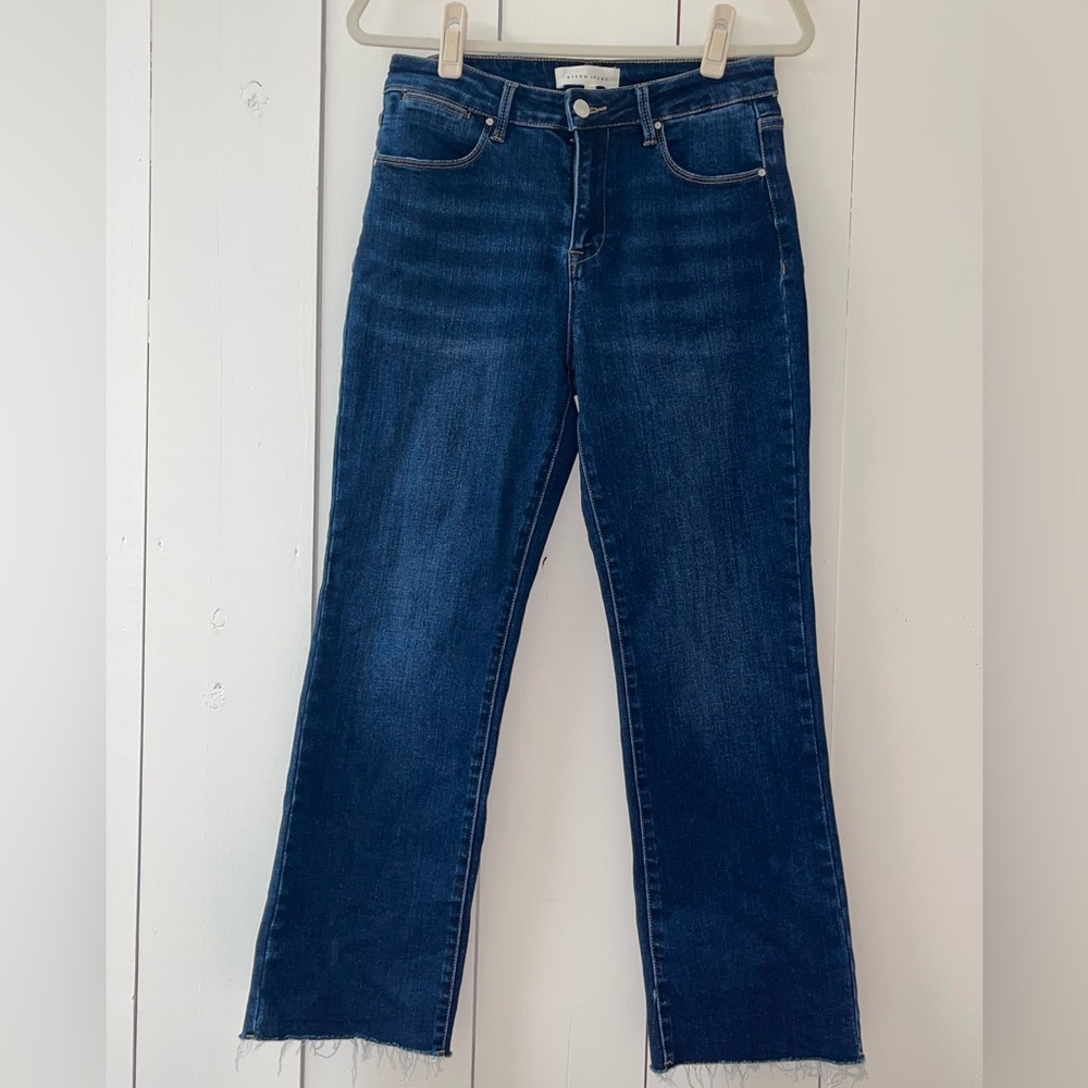 Risen Mid-rise, straight fit, raw hem jeans.
